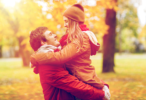 love, relationships, season and people concept - happy young couple meeting in autumn park