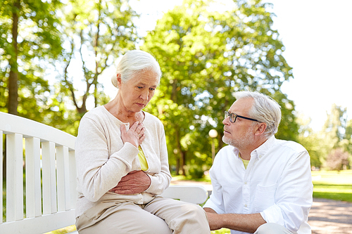 old age, health problem and people concept - senior woman feeling sick at summer park