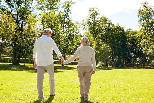 old age, relationship and people concept - happy senior couple walking at summer city park