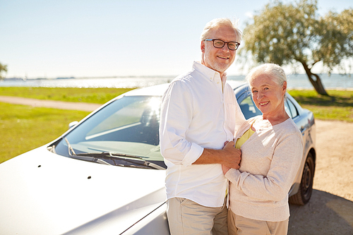 road trip, travel and old people concept - happy senior couple at car in summer