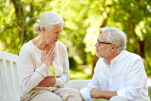 old age, health problem and people concept - senior woman feeling sick at summer park