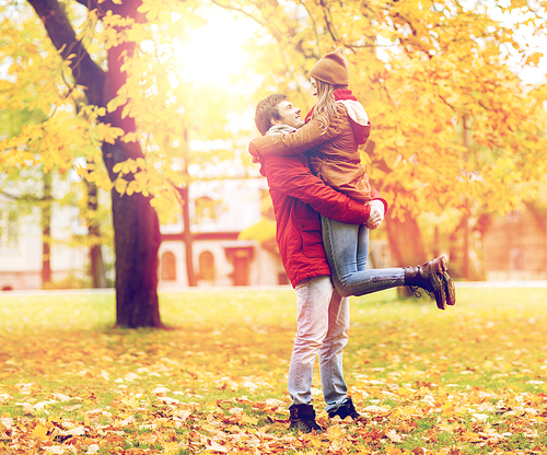 love, relationships, season and people concept - happy young couple meeting in autumn park