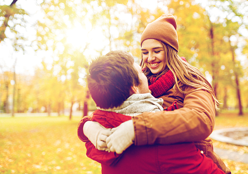 love, relationships, season and people concept - happy young couple meeting in autumn park