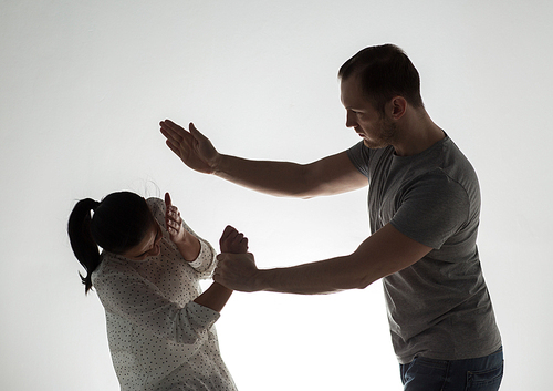 domestic violence, people and abuse concept - couple having fight and man slapping woman