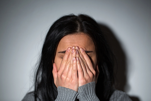 people, grief and domestic violence concept - unhappy crying woman