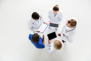 medicine, healthcare, people and cardiology concept - group of doctors with cardiogram and tablet pc computers at hospital