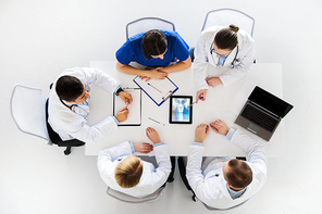 medicine, healthcare and surgery concept - group of doctors or surgeons discussing spine x-ray on tablet pc computer screen at hospital