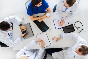 medicine, healthcare and people concept - group of doctors having coffee break at hospital