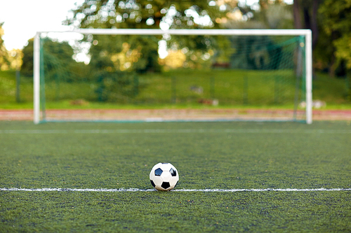 sport, soccer and game - ball and goal on football field