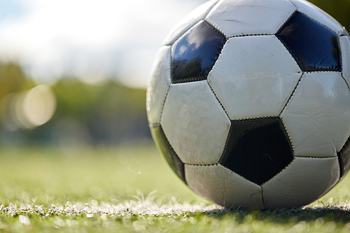 sport, soccer and game - close up of ball on football field