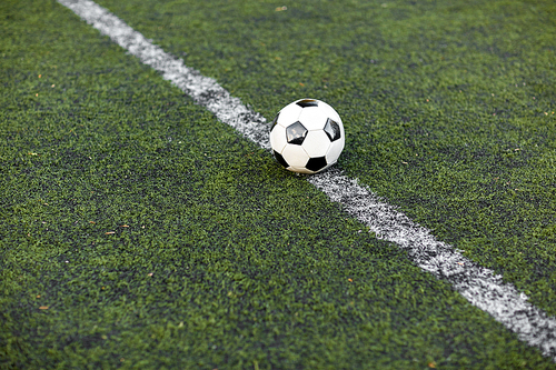 sport, soccer and game - ball on football field
