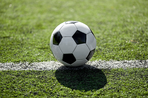 sport, soccer and game - ball on football field