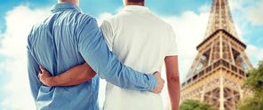 people, homosexuality, same-sex marriage, gay and love concept - close up of happy male gay couple hugging from back over paris eiffel tower background