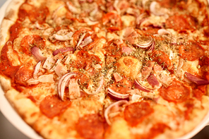 fast food, italian cuisine, cooking and eating concept - close up of pizza