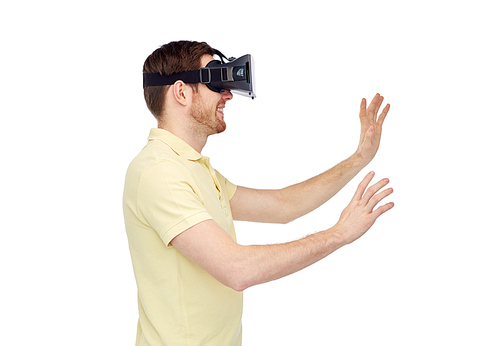 3d technology, virtual reality, entertainment and people concept - happy young man with virtual reality headset or 3d glasses playing game