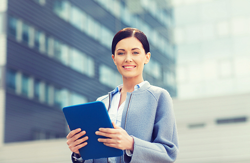 business, technology and people concept - young smiling woman with tablet pc computer over office building