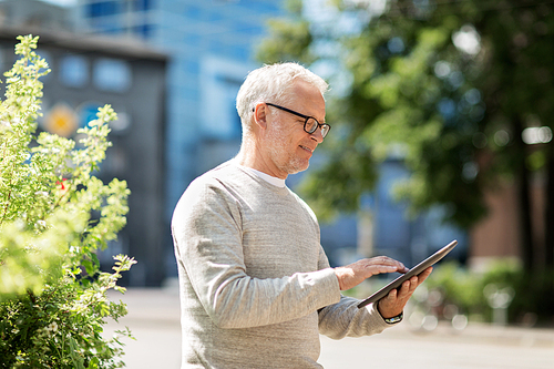 technology, people and lifestyle concept - senior man with tablet pc on city street