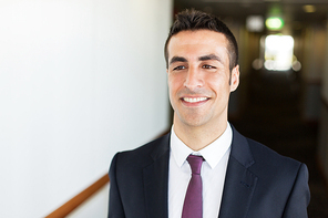 business and people concept - businessman in suit at corridor in hotel