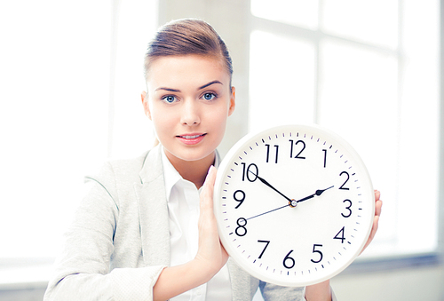 picture of attractive businesswoman showing white clock