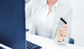 banking, shopping, money concept - businesswoman with laptop and credit card