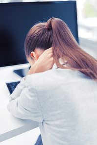 business, office, school and education concept - stressed businesswoman with computer at work