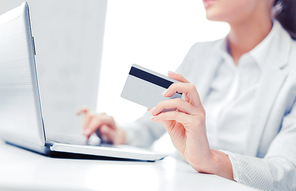 banking, shopping, money concept - businesswoman with laptop and credit card