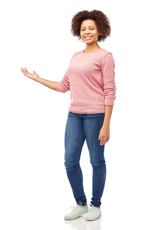 people, race, ethnicity and portrait concept - happy african american young woman holding something imaginary on hand over white