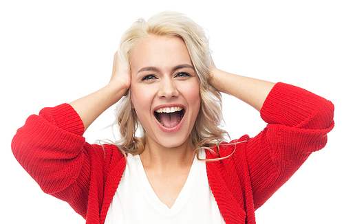 fashion, portrait and people concept - happy young woman in red cardigan holding her head and laughing