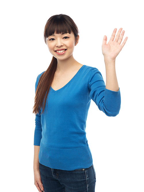 people, race, ethnicity and gesture concept - happy smiling young asian woman waving hand over white