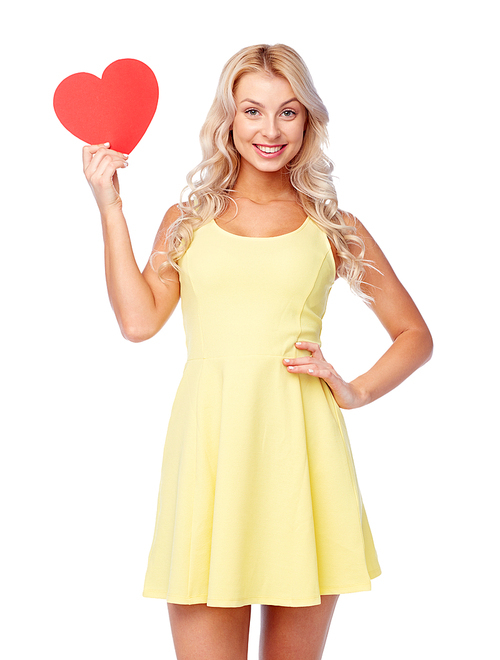 love, valentines day and people concept - smiling young woman in dress with red paper heart