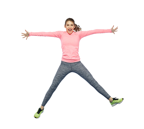 sport, fitness, motion and people concept - happy smiling young woman jumping in air over white background