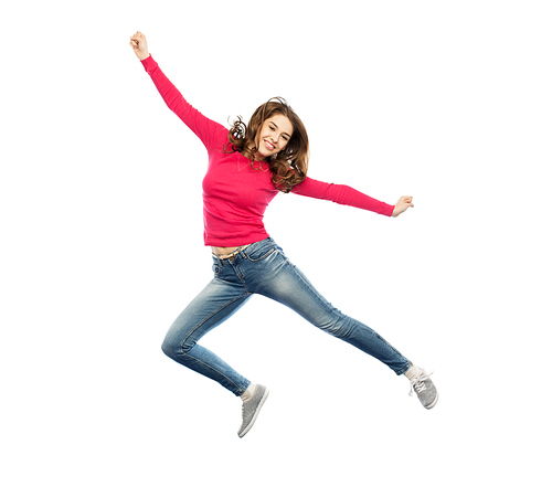 happiness, freedom, motion and people concept - smiling young woman jumping in air over white background