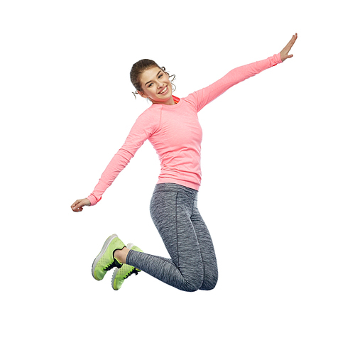 sport, fitness, motion and people concept - happy smiling young woman jumping in air over white background