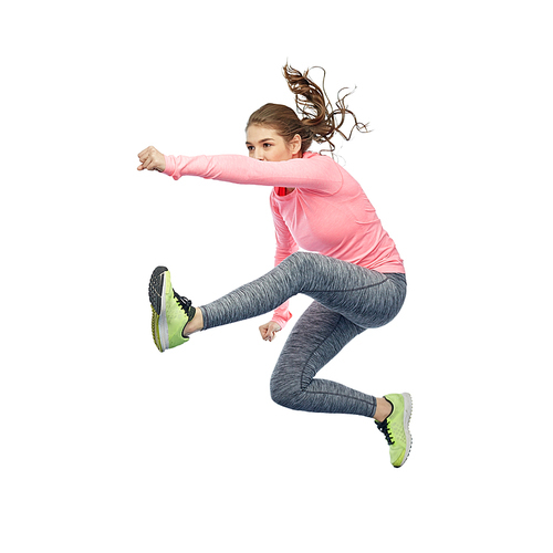 sport, fitness, motion and people concept - happy young woman jumping in air in fighting pose over white background