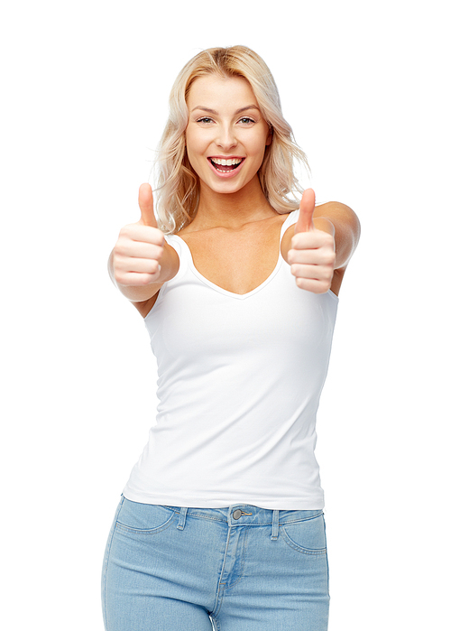 gesture, expressions and people concept - happy smiling young woman in white top and jeans showing thumbs up