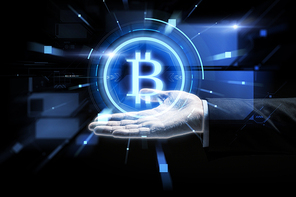 cryptocurrency, finance and business concept - close up of businessman hand with virtual bitcoin symbol hologram over black background