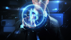 cryptocurrency, finance and business concept - close up of businessman with virtual bitcoin symbol hologram over black background