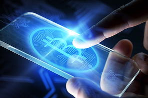 business, cryptocurrency and future technology concept - close up of hands with virtual bitcoin symbol hologram transparent smartphone screen over black background