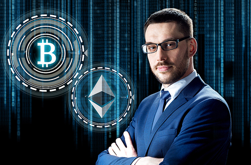 cryptocurrency, financial technology and business concept - businessman with ethereum and bitcoin holograms over binary code background