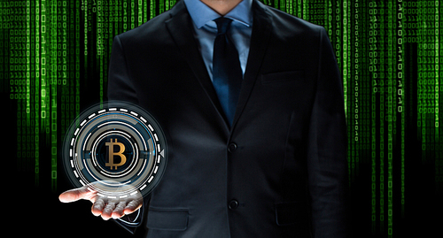 cryptocurrency, financial technology and business concept - close up of businessman with virtual bitcoin symbol hologram over and binary code and black background