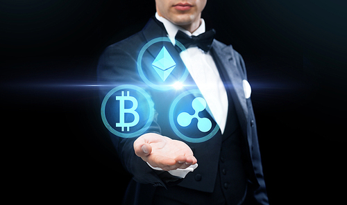 cryptocurrency, financial technology and business concept - man in tailcoat with virtual bitcoin, ethereum and ripple icons over black background