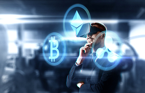 cryptocurrency, financial technology and business concept - businessman in virtual reality headset with ethereum, bitcoin and ripple holograms over abstract background