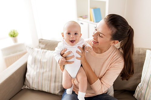 family, motherhood and people concept - happy mother with little baby boy at home