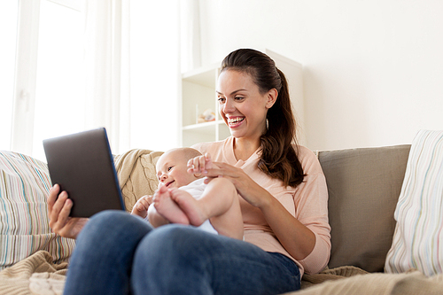 family, motherhood, technology and people concept - happy mother and little baby boy with tablet pc computer at home