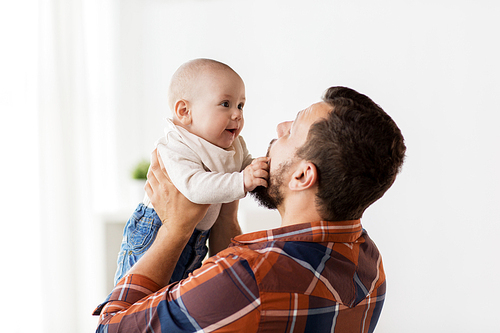 family, childhood, babyhood and people concept - happy little baby boy with father at home
