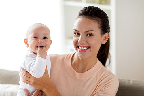 family, motherhood and people concept - happy mother with little baby boy sucking finger