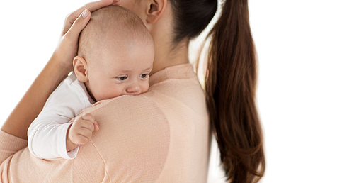 family, motherhood and people concept - close up of little baby boy with mother