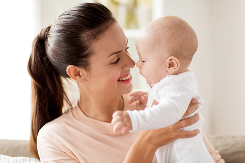 family, motherhood and people concept - happy mother with little baby boy at home