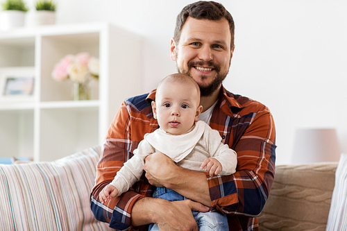 family, parenthood and people concept - happy father with little baby boy at home