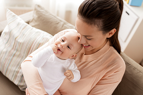 family, motherhood and people concept - happy mother with little baby boy at home